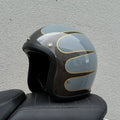 Retro-style glass fibre half motorcycle helmet shown in a selection of colours and prints.