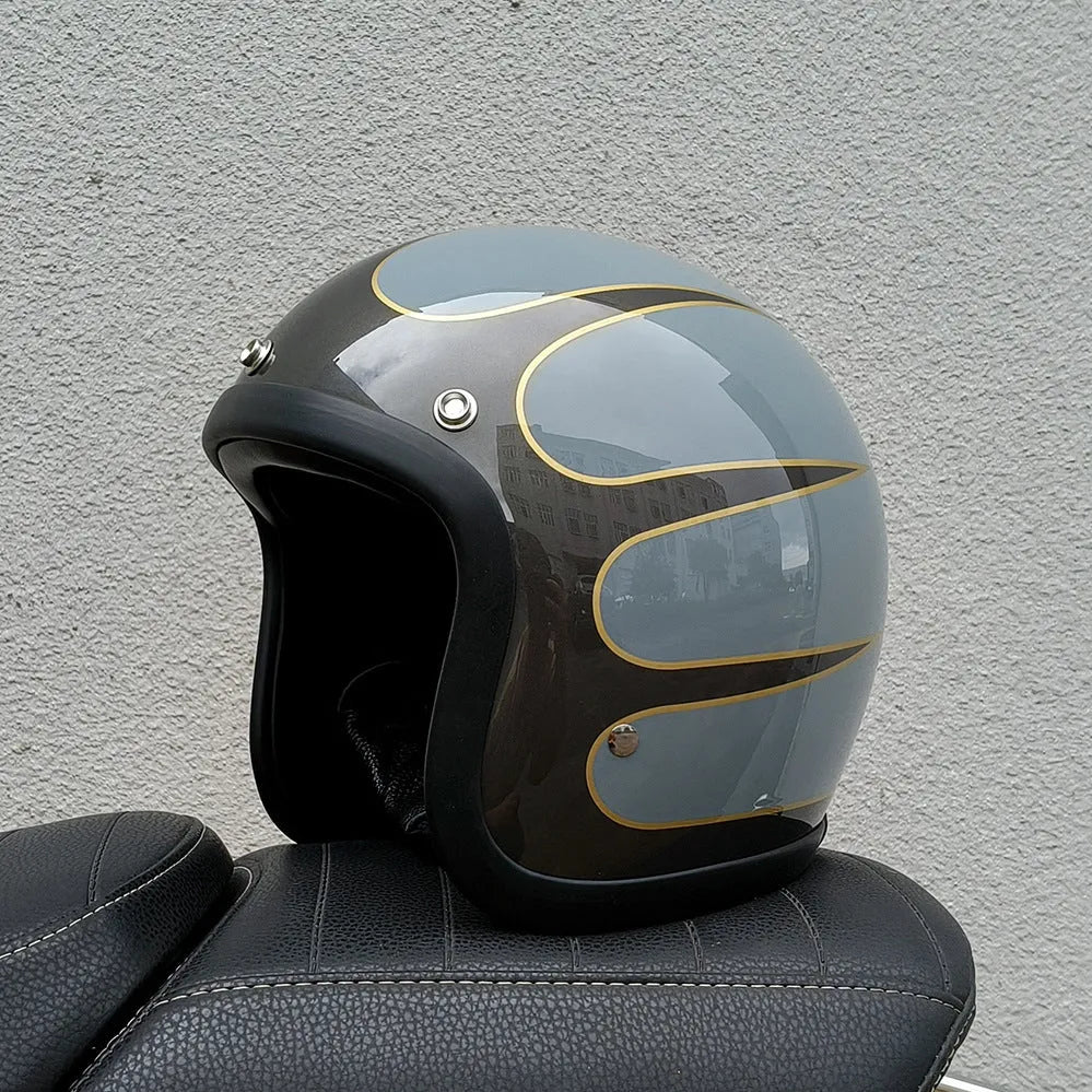 Retro-style glass fibre half motorcycle helmet shown in a selection of colours and prints.