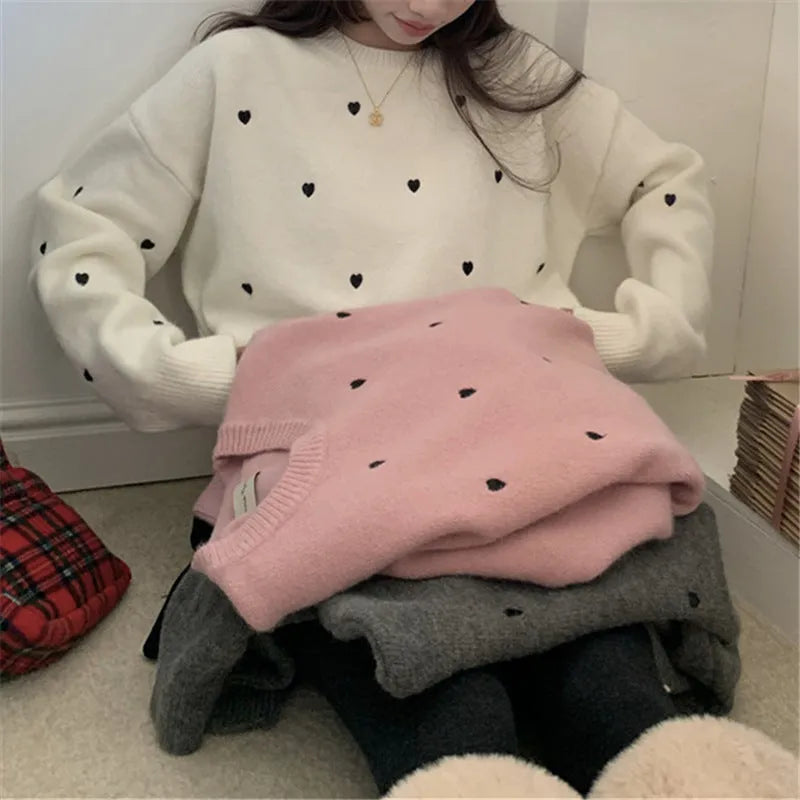 Women's loose grey acrylic pullover sweater with love-pattern embroidery on the front.