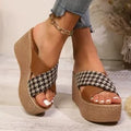 Casual brown and black plaid wedge sandals with a non-slip rubber sole.