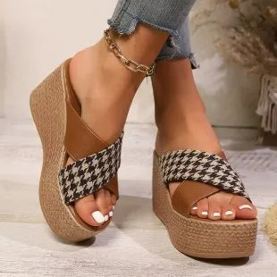 Casual brown and black plaid wedge sandals with a non-slip rubber sole.