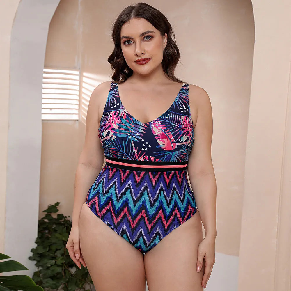 Women's blue printed one-piece swimsuit with spaghetti straps and a striped vest design on a mannequin.