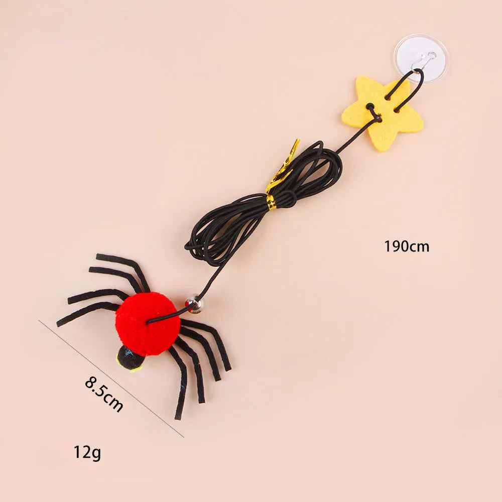 Hanging door cat toy with elastic rope, feather, bell and spider attachments in red or yellow colour