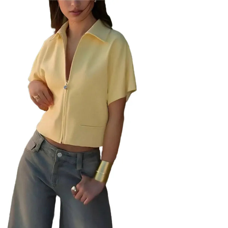 A woman wearing a loose-fit yellow short sleeve casual polyester top.