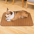 Brown rattan fibre dog cooling mat shown on a floor, available in multiple sizes.