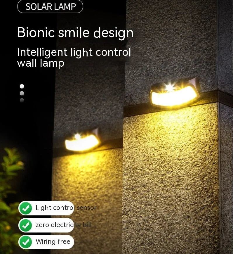 Solar outdoor wall lamp with smiling face design for garden decorative lighting