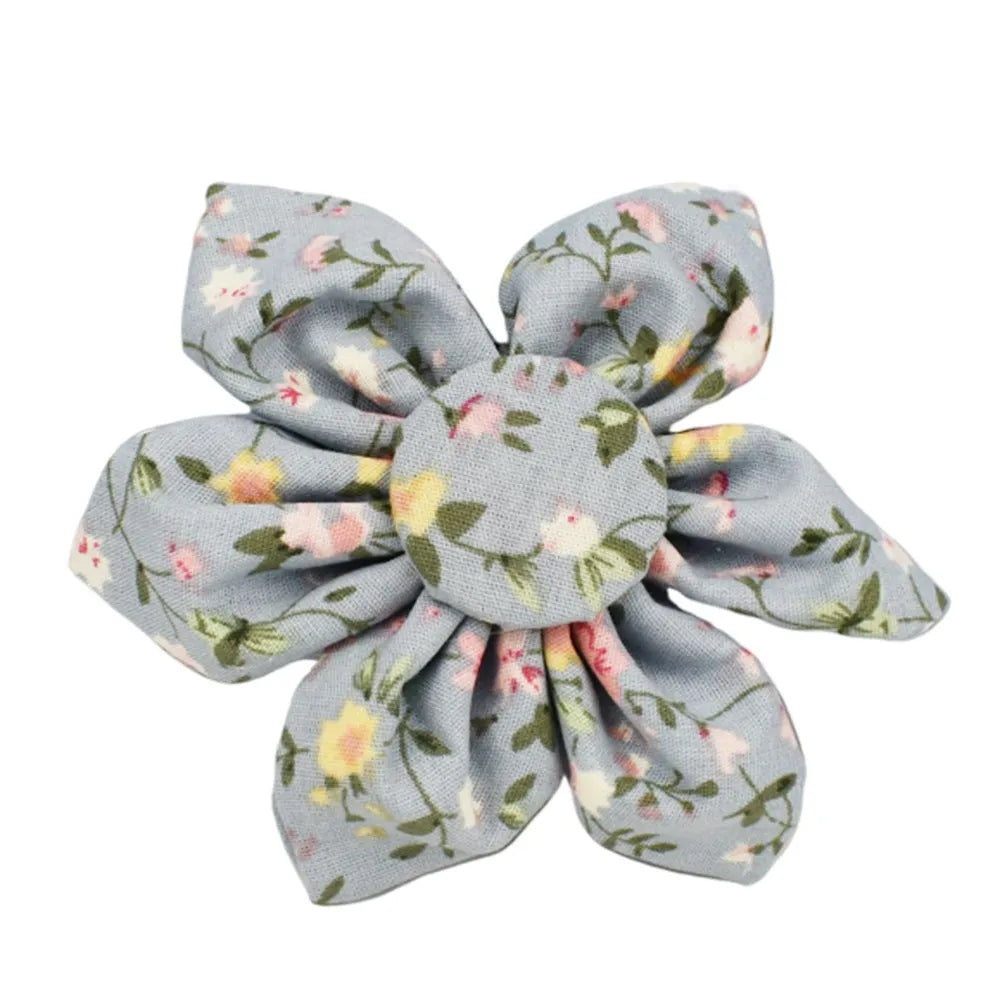 Blue floral cloth dog collar and leash set with bow and vest accessories on a size chart from XS to XL.