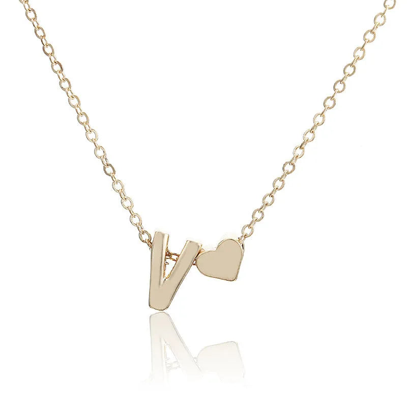Peach heart shaped letter necklace pendant in gold and silver alloy colours.