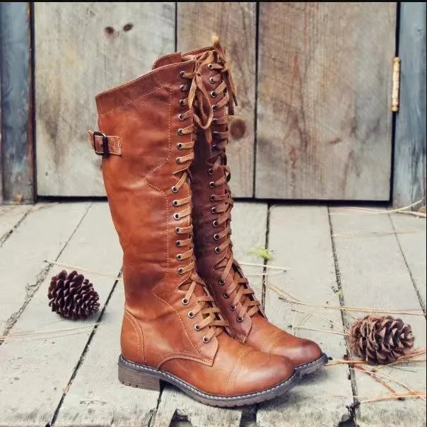 Black women's chunky heel high-leg casual boots with a round toe on a plain background.