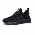 Men's fly weave casual trainers with cross-strap design and low heel in black, orange, or yellow
