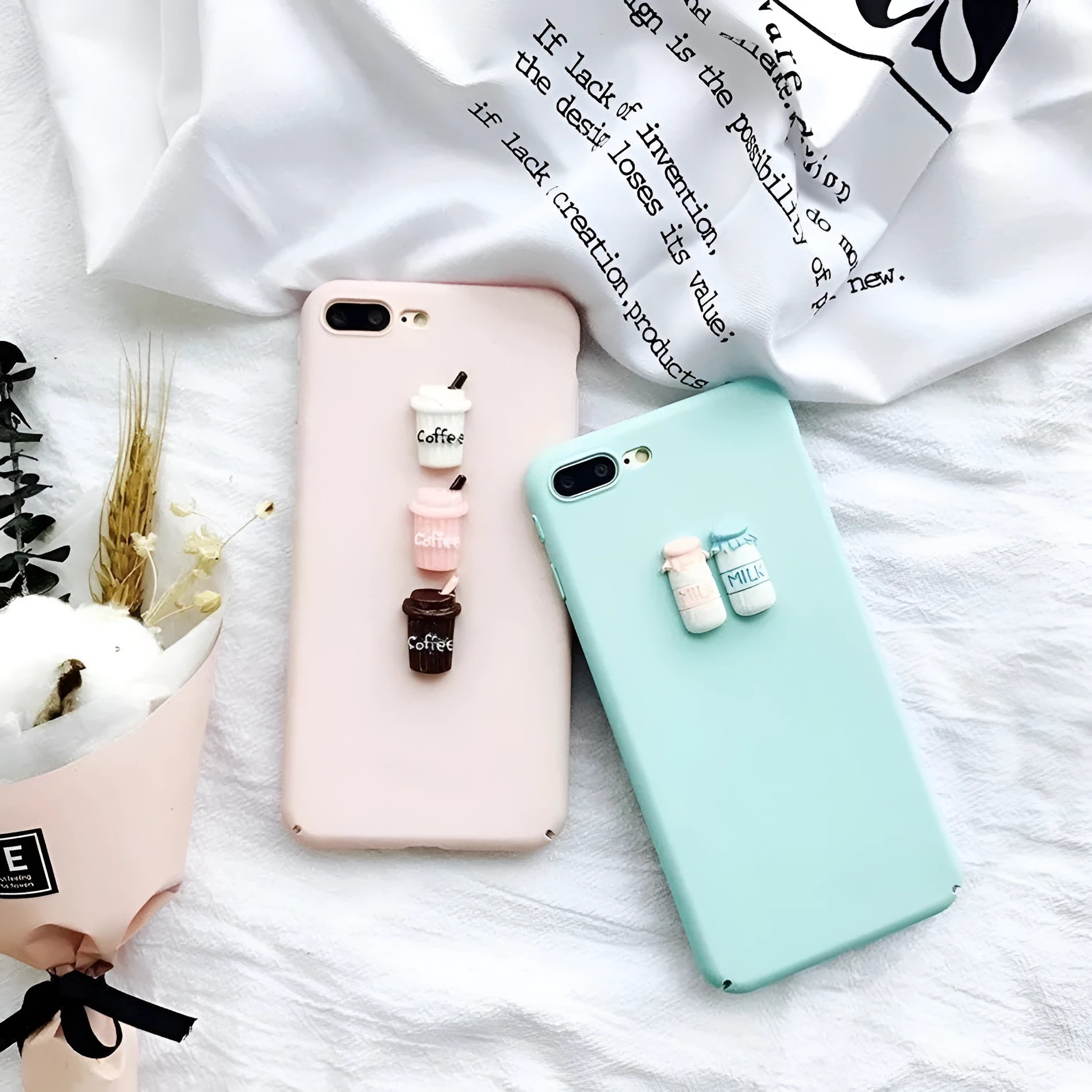 Soft silicone iPhone case with a raised 3D cartoon cat design on the back, shown in pink.