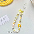 Colourful beaded flower lanyard for mobile phones with blue, pink, or yellow plastic flowers on an adjustable rope strap.