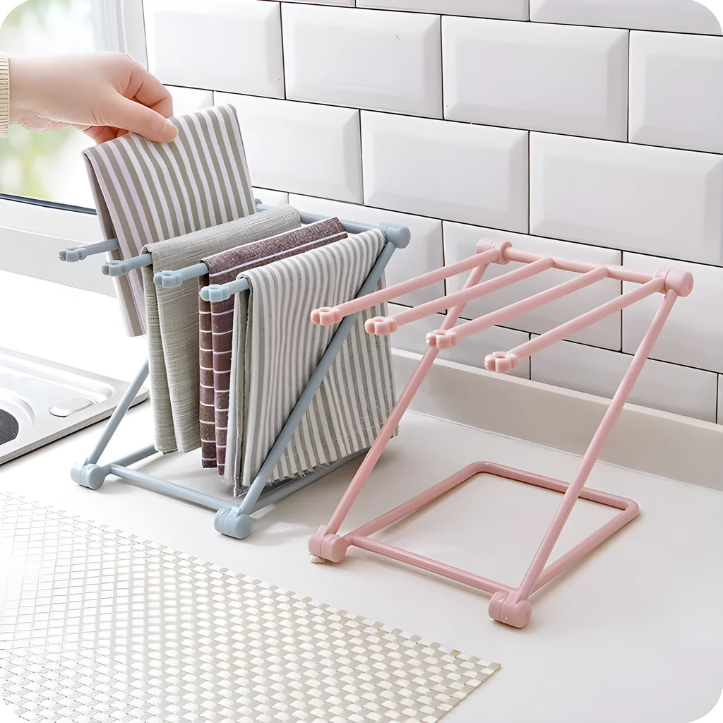Light grey foldable plastic dishcloth shelf on a kitchen countertop