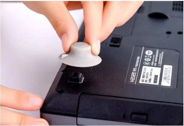 Grey durable plastic laptop cooling pad stand with two large and two small non-slip pads.