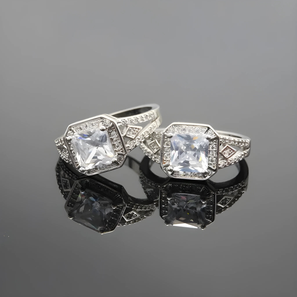 Platinum colour geometric women's ring with hollow design and inlaid zircon stone.