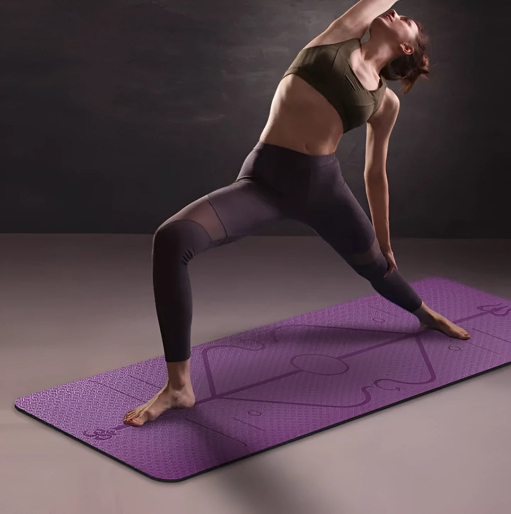 TPE yoga mat in bamboo blue with body position line, 6mm thick, rolled out on a wooden floor