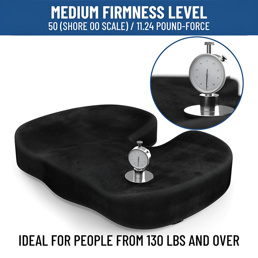 Black U-shaped memory foam seat cushion for office chairs, shown on a wooden seat.