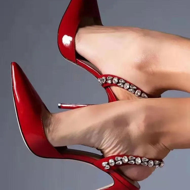 Women's black patent leather pointed-toe high heel sandals with side rhinestone decoration.