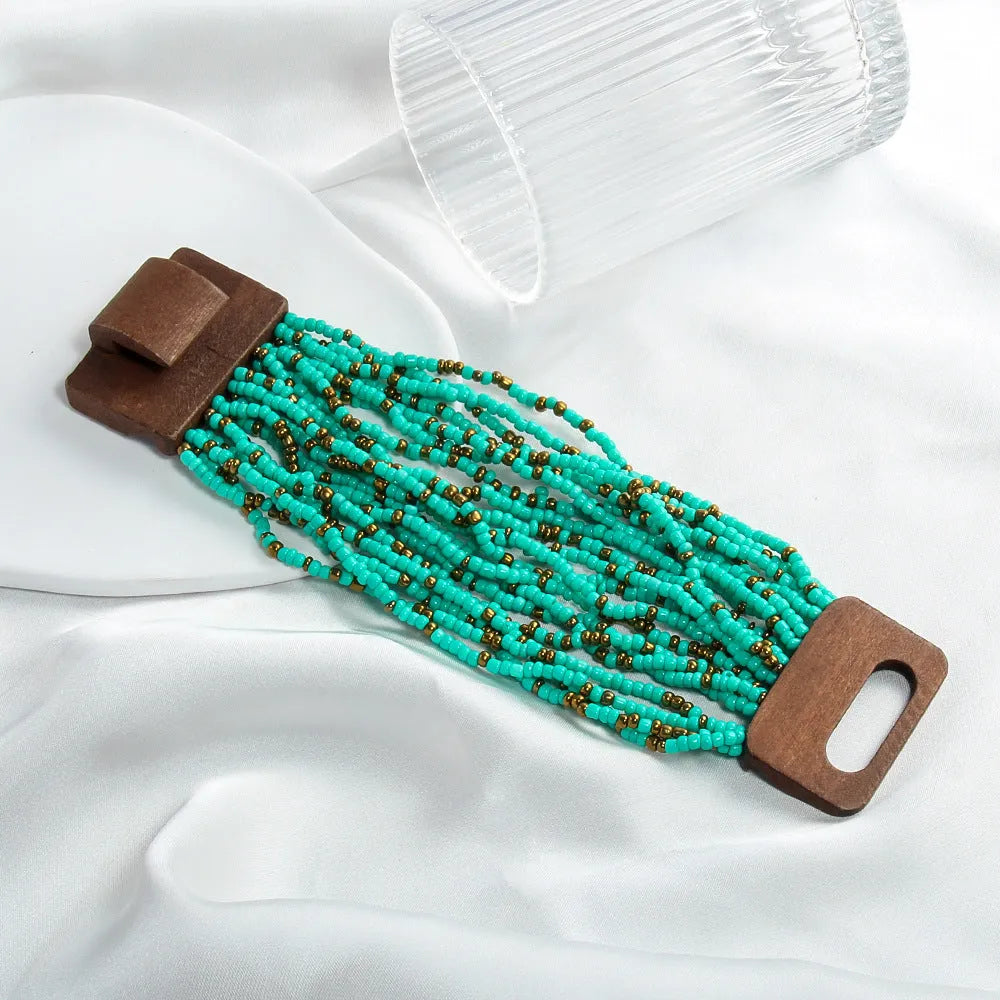 Handmade multi-layer elastic bracelet with rice-shaped glass and coloured glaze beads in geometric quadrilateral pattern, six colour options