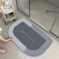 Cushioned bathroom floor mat with non-slip backing in blue colour showing oval shape on bathroom tiles