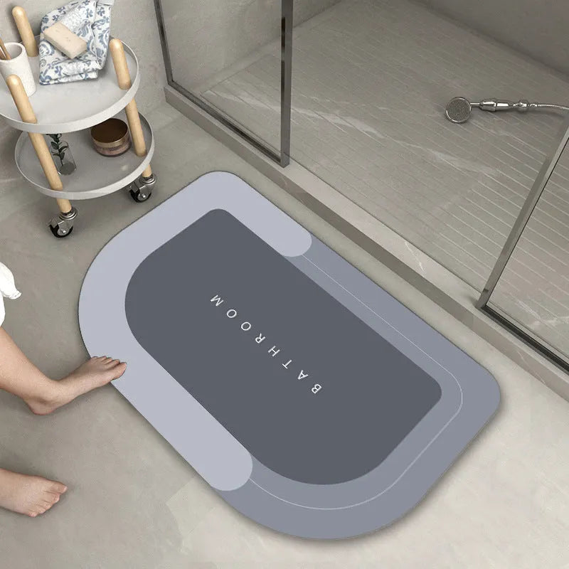 Cushioned bathroom floor mat with non-slip backing in blue colour showing oval shape on bathroom tiles