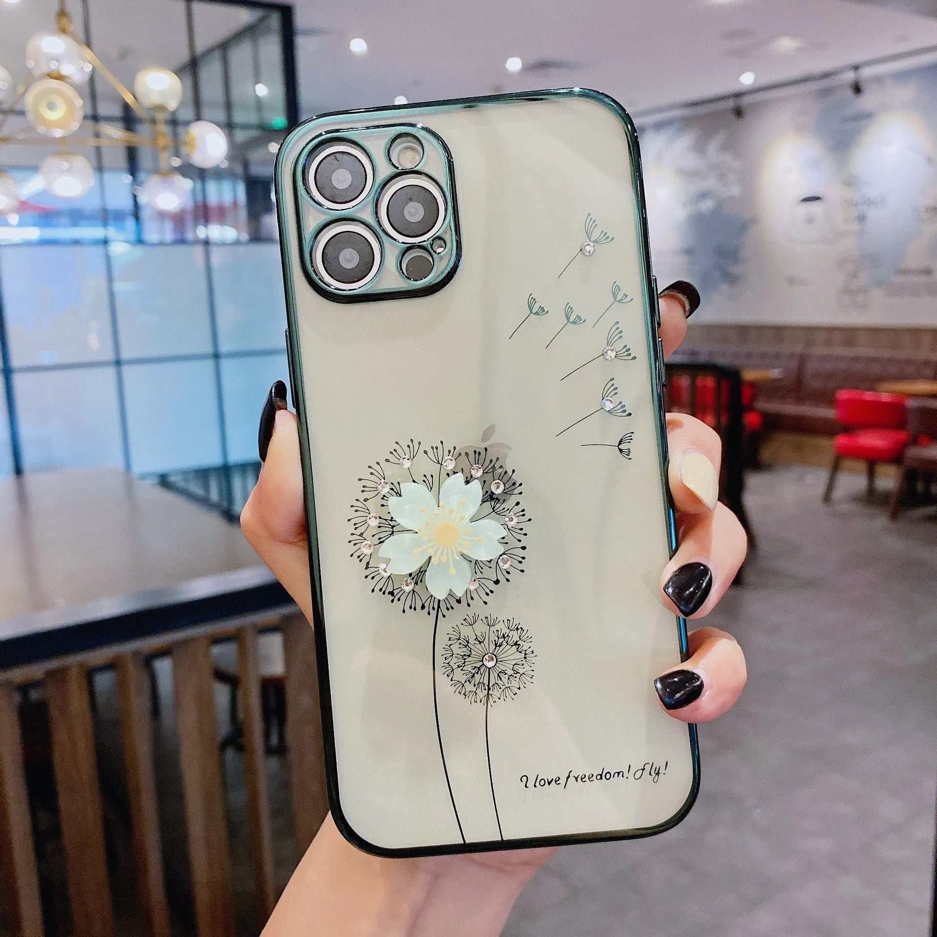 Green iPhone case with a 3D white flower design and a rotating stand on the back.