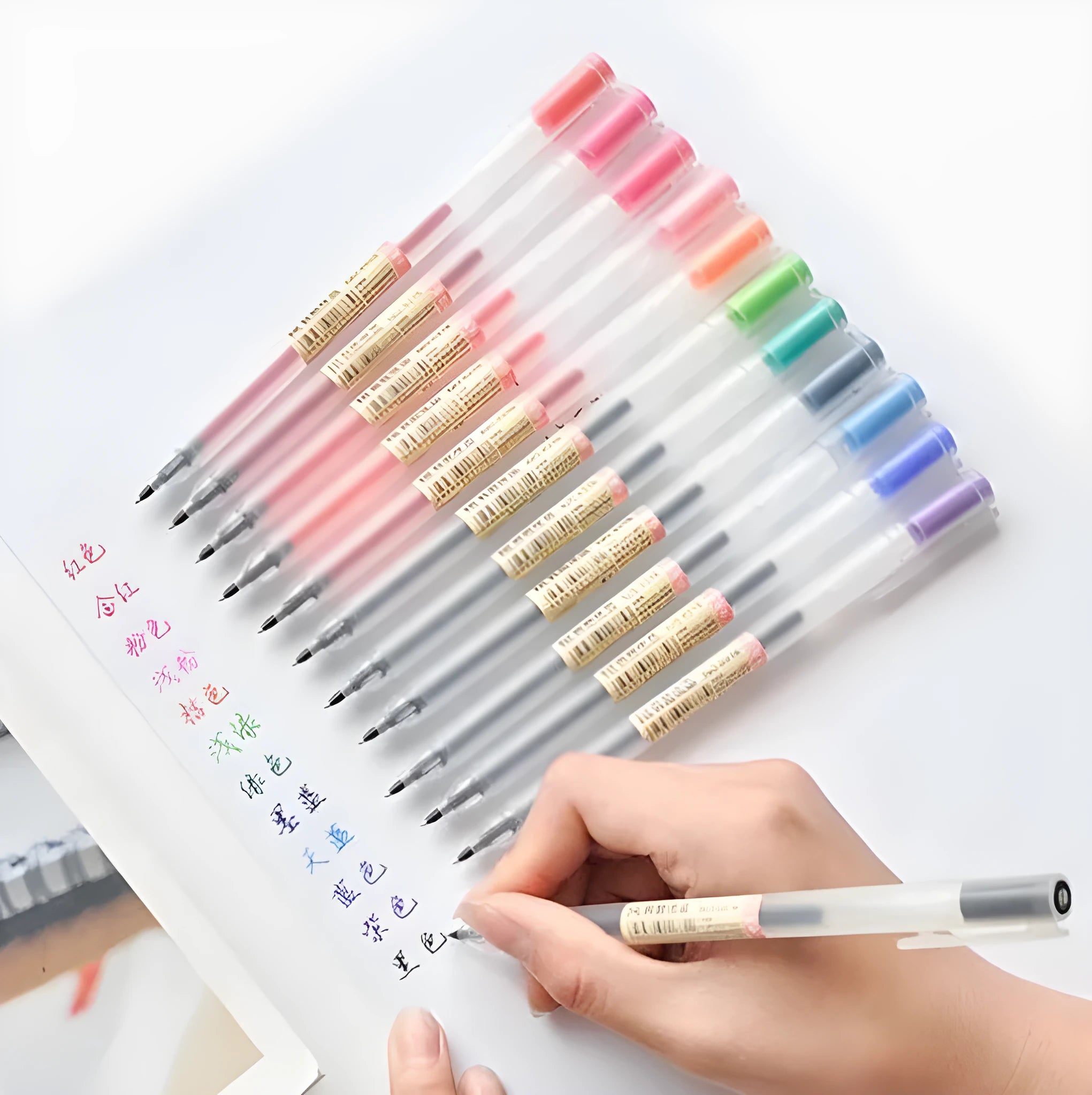 Pack of 12 black Muji gel pens with 0.5mm fine tips on a white background.