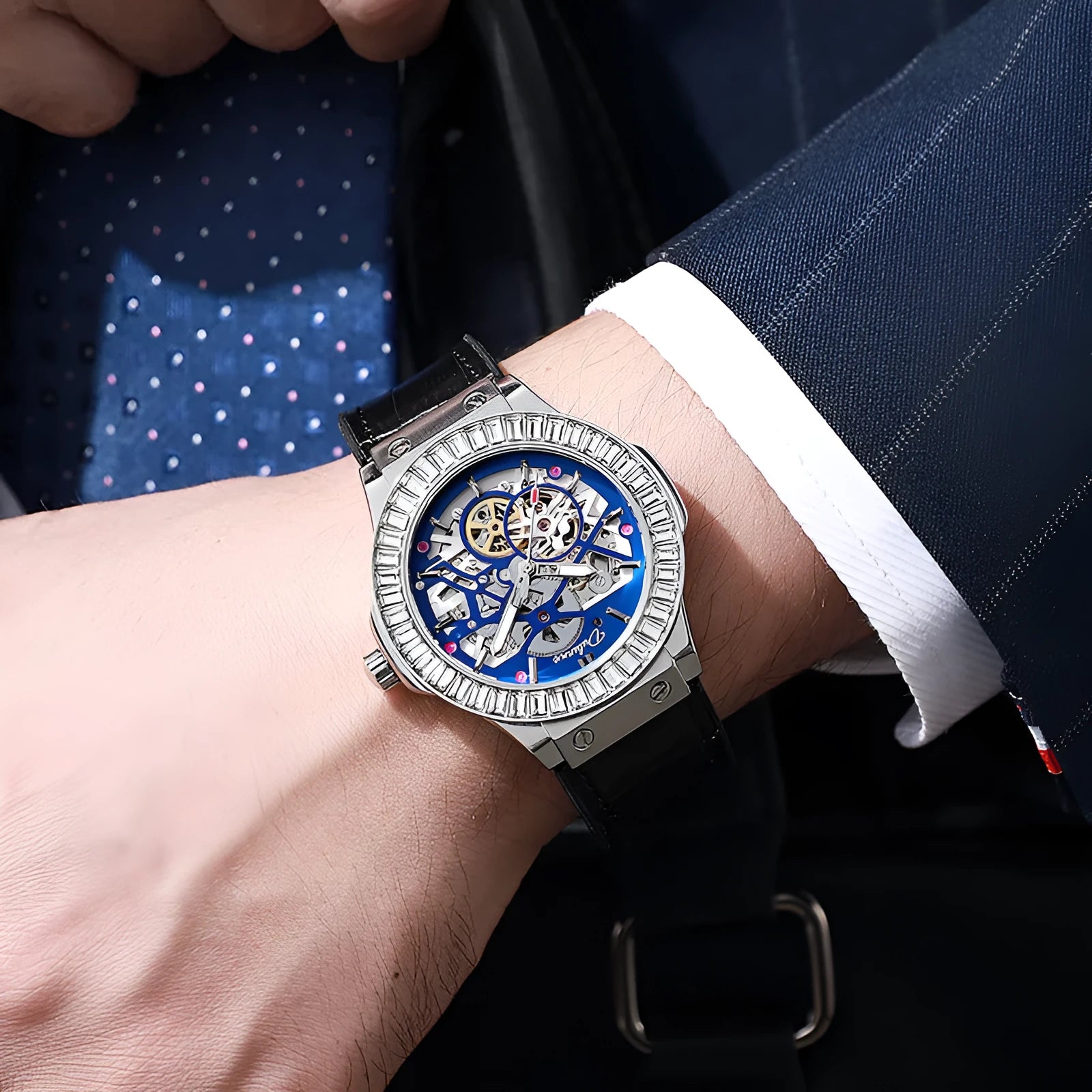 Men's automatic skeleton watch with diamond accents on dial, stainless steel case, leather strap.