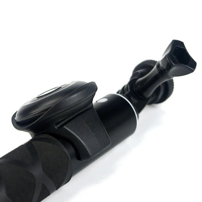 Black Bluetooth selfie remote with a clip-style snap grip for handheld or mounted use.