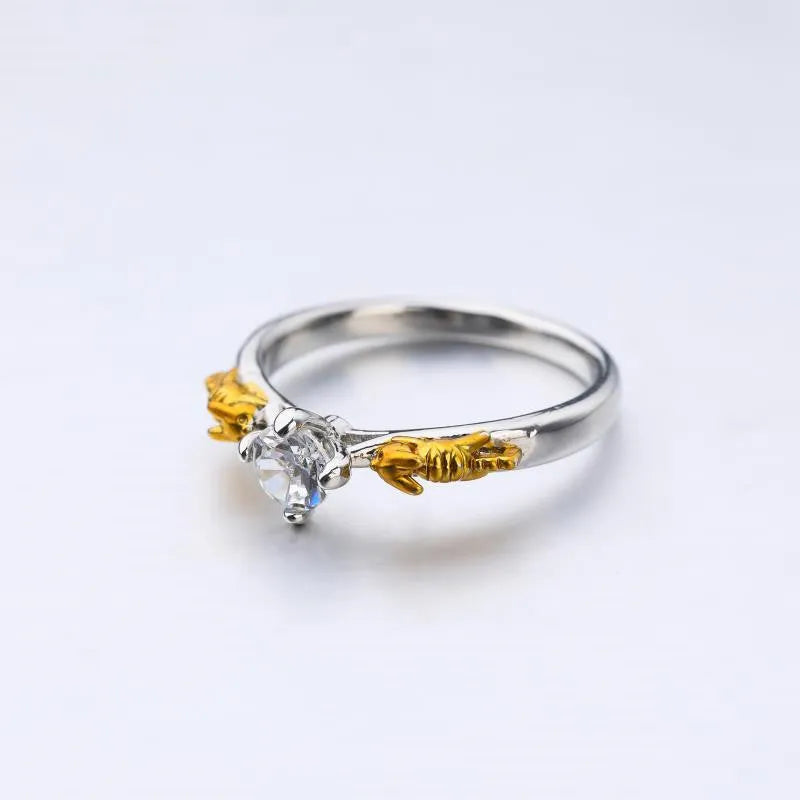 Black gold copper crown modelling ring for cosplay on a plain background.