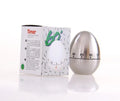 Egg-shaped stainless steel mechanical kitchen timer on a kitchen countertop.