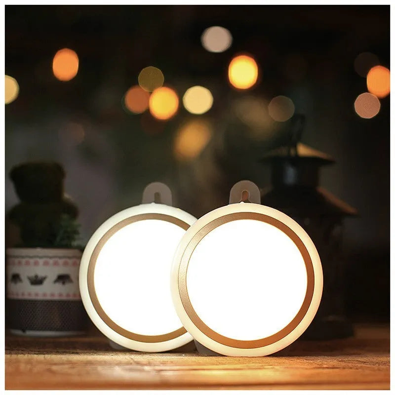 Compact round white motion sensor LED light for automatic wardrobe and corridor lighting.