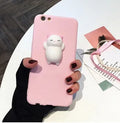 Soft silicone iPhone case with a raised 3D cartoon cat design on the back, shown in pink.
