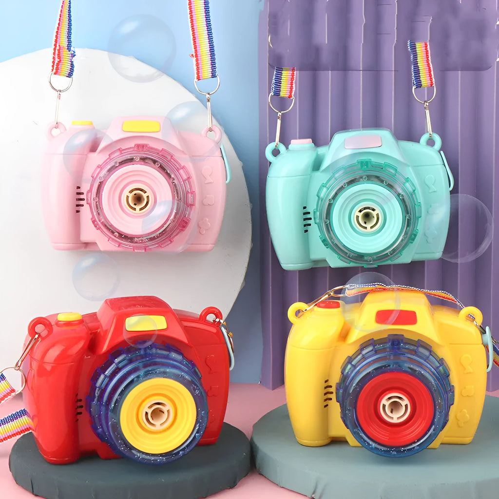 Yellow automatic camera-shaped bubble machine for children on a green lawn, producing soap bubbles.
