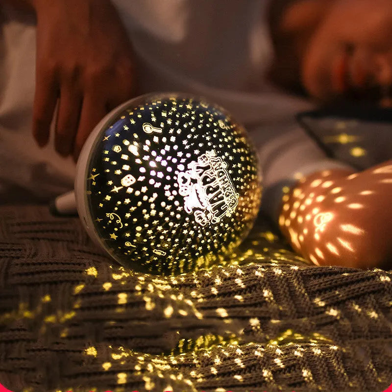 Black and white rotating starlight projection lamp with cartoon style, battery powered.
