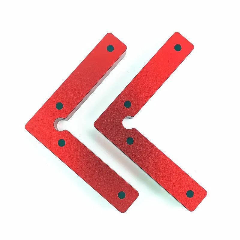 Aluminium alloy right angle woodworking positioning block on a workbench.