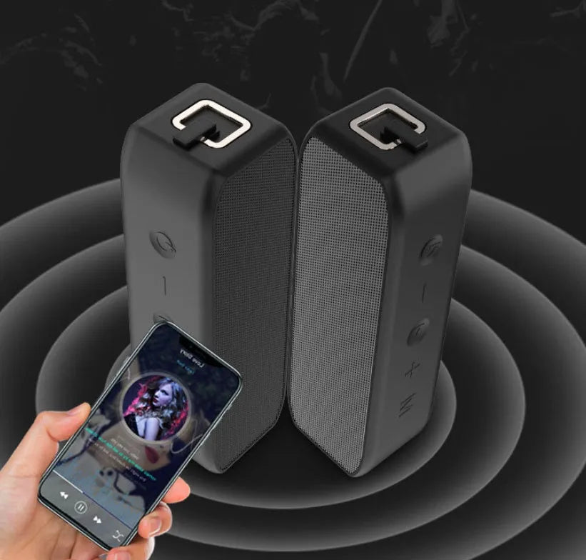 Black waterproof wireless Bluetooth speaker with control buttons and connectivity ports