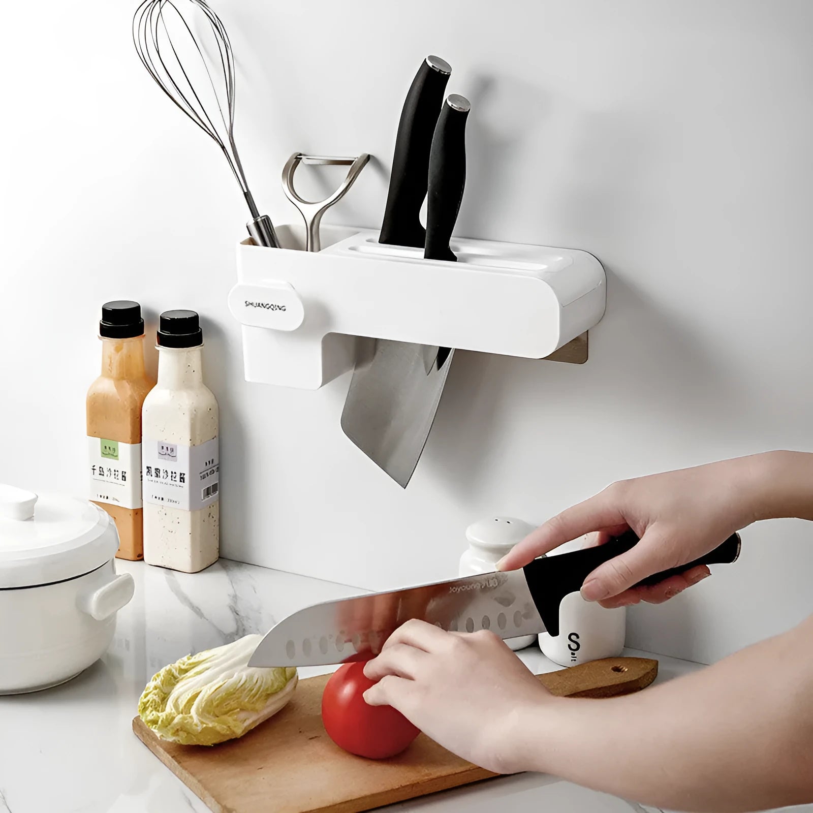 White plastic kitchen knife storage block with modern simple design on countertop