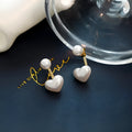 Heart-shaped pearl stud earrings with Korean design, alloy metal and artificial gemstone details