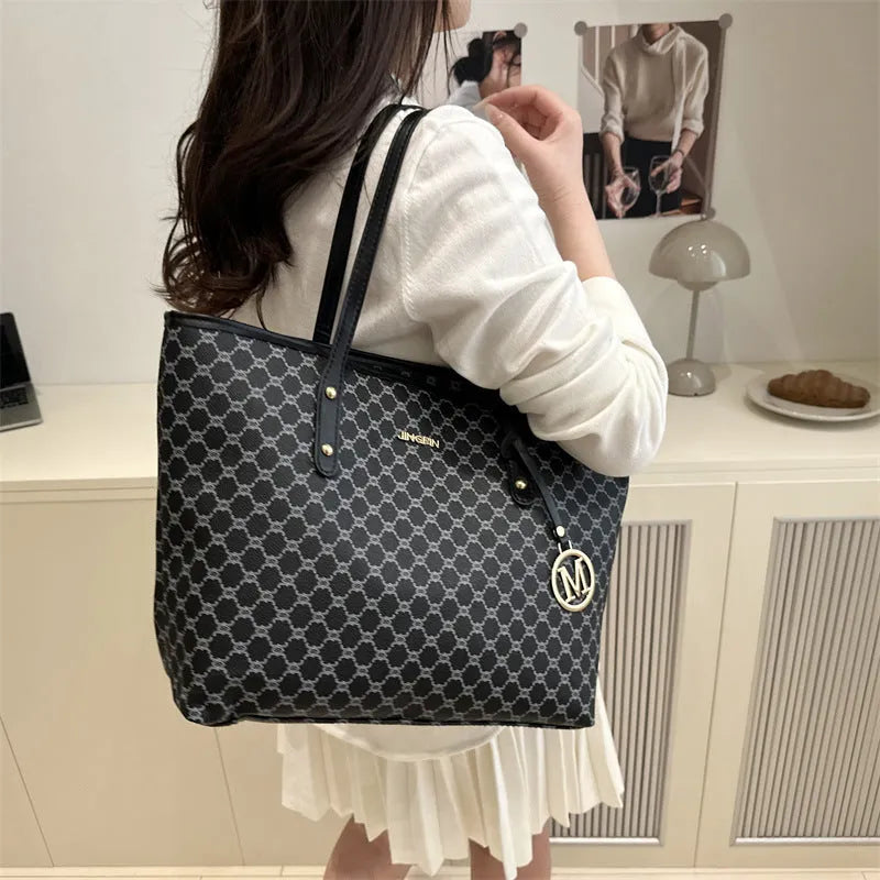 Women's western style PU leather shoulder bag in black showing visible sewing thread details.