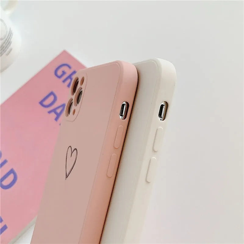 Solid colour silicone phone case for iPhone shown in black, green, grey, light green, pink, purple, red, and white options