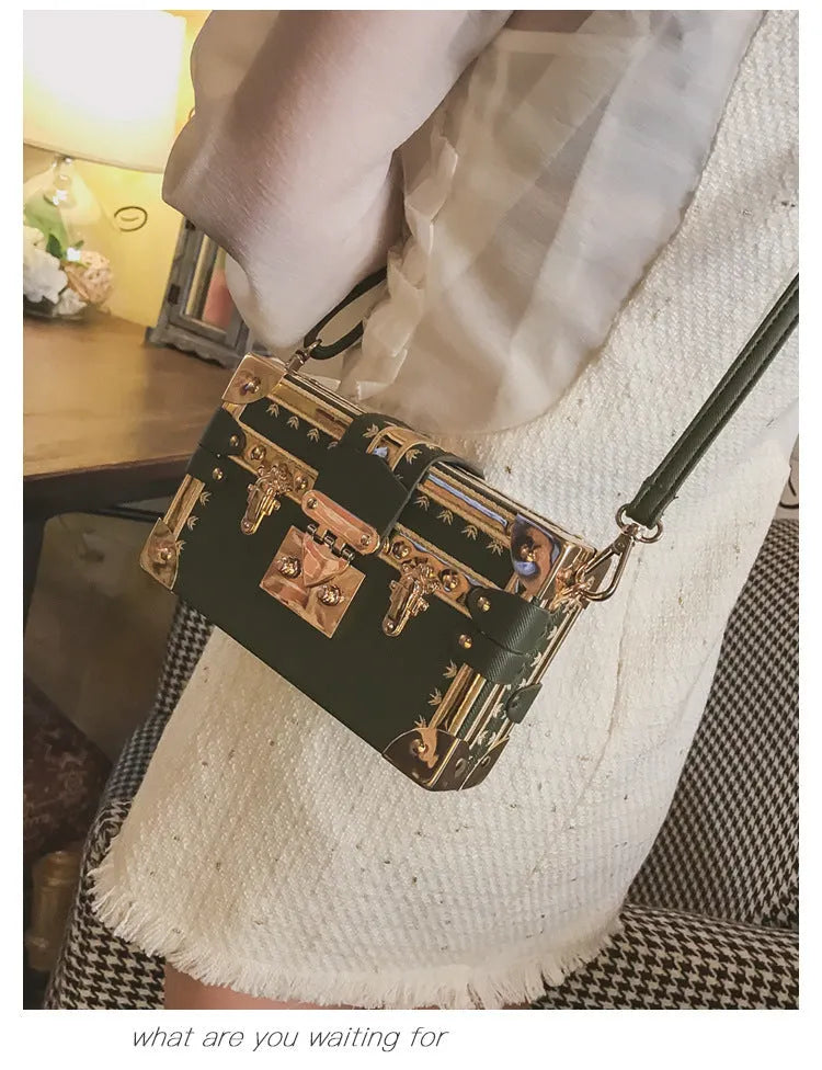 Hard black PU leather women's crossbody flap bag with metal rivet detail and hasp closure.