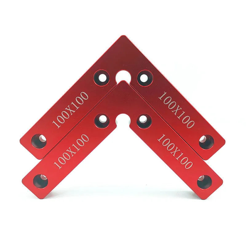 Aluminium alloy right angle woodworking positioning block on a workbench.
