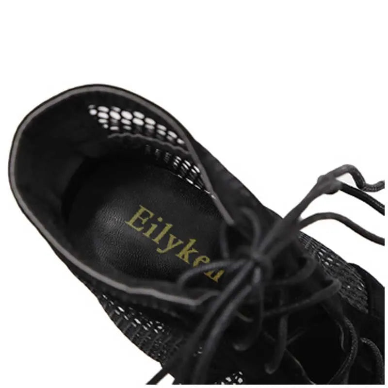 Black suede women's lace-up high heel shoes with an 11.5cm heel and 1cm front platform.