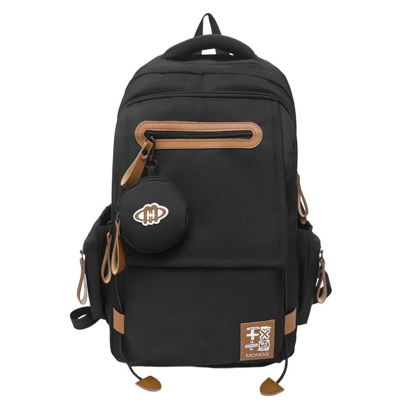 Japanese leisure travel backpack in black with contrast stitching and 20-35 litre capacity