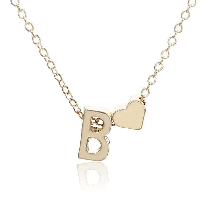 Peach heart shaped letter necklace pendant in gold and silver alloy colours.