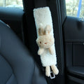Cartoon plush car seat belt shoulder protector in lamb wool, showing rabbit and bear designs.