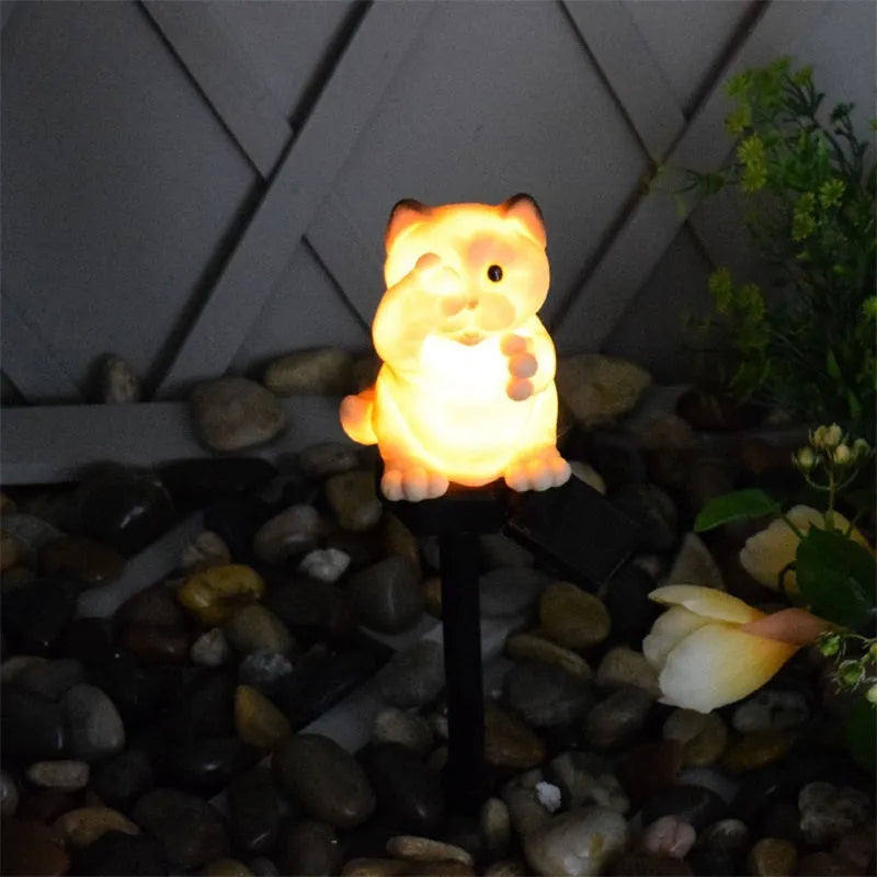 Brown or grey resin cat-shaped solar lawn light for garden and courtyard decoration.