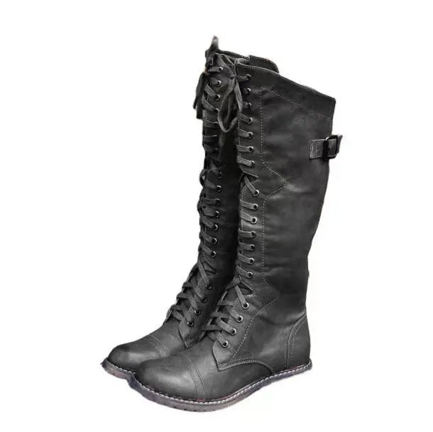 Black women's chunky heel high-leg casual boots with a round toe on a plain background.