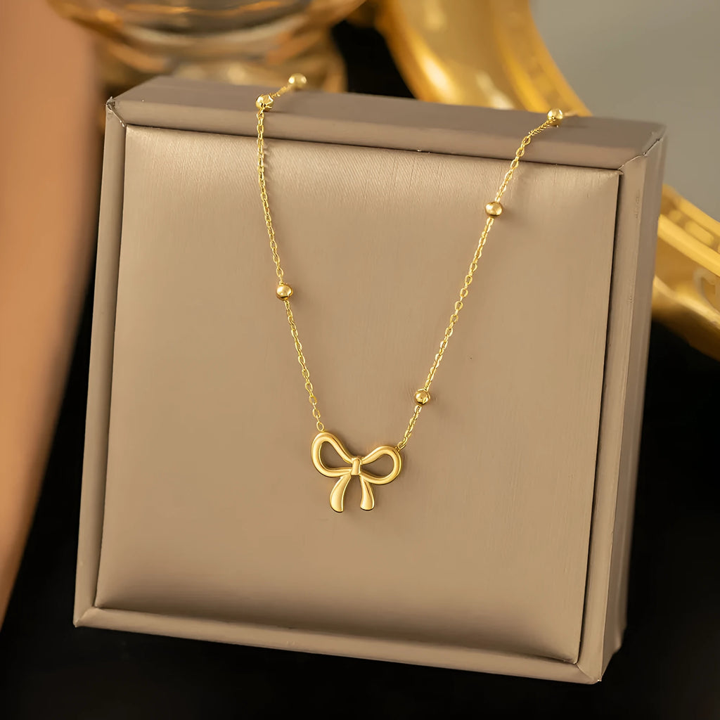 Gold bow necklace on cross chain with 41-50cm perimeter for women's office fashion